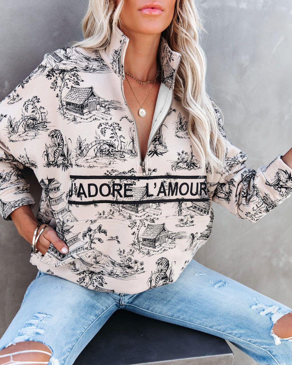 Sudadera estampada con media cremallera y cuello alto